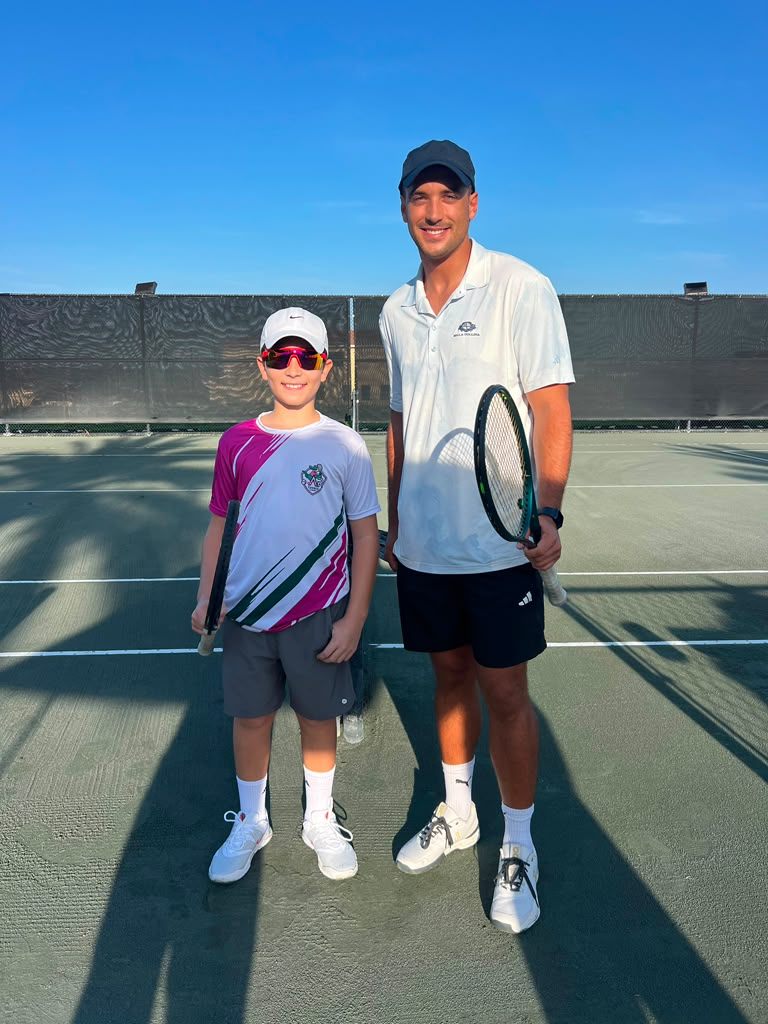 Junior player with coach